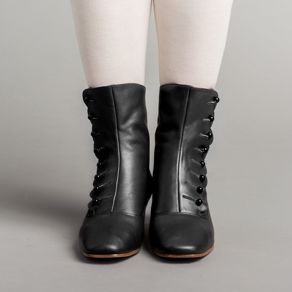 Black boots with buttons on the side on sale